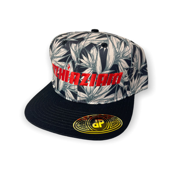 A stylish and trendy black baseball cap with a flat bill and an adjustable snap back. The front of the cap features a vibrant Red color embroidery with the word "Azhiaziam". The visor and back of the cap showcase a unique Birds of Paradise print.