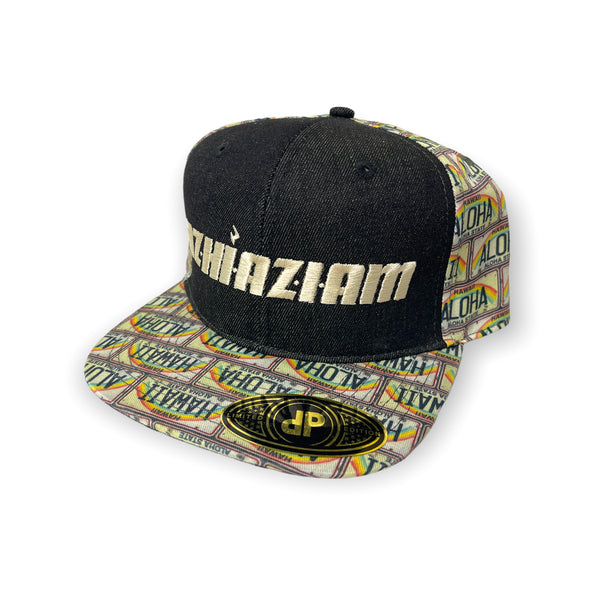 A stylish and trendy black baseball cap with a flat bill and an adjustable snap back. The front of the cap features Cream embroidery with the word "Azhiaziam". The visor and back of the cap showcase a unique rainbow style Hawaii license plate print.